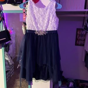 White and blue dress. Floral sparkly top ties in the back.